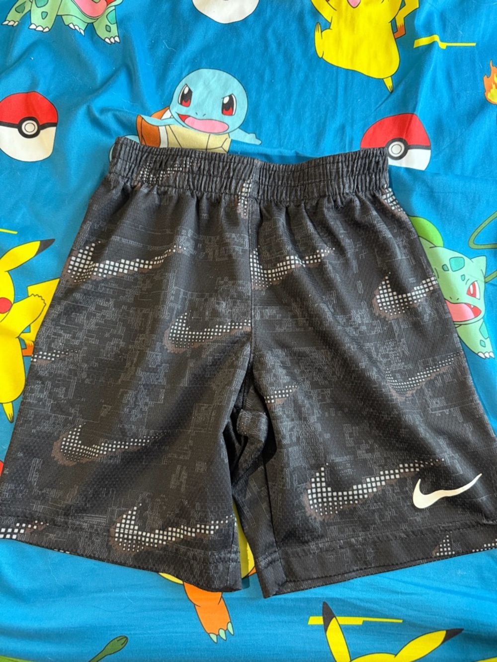Nike Black Boys' Athletic Shorts with White Swoosh Pattern